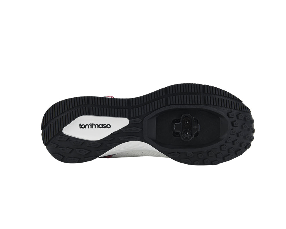 Black sole of a shoe with 'tommaso' branding on a white background