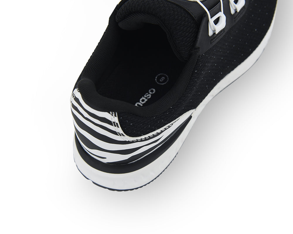 Black and white indoor cycling shoe with zebra pattern heel on a white background