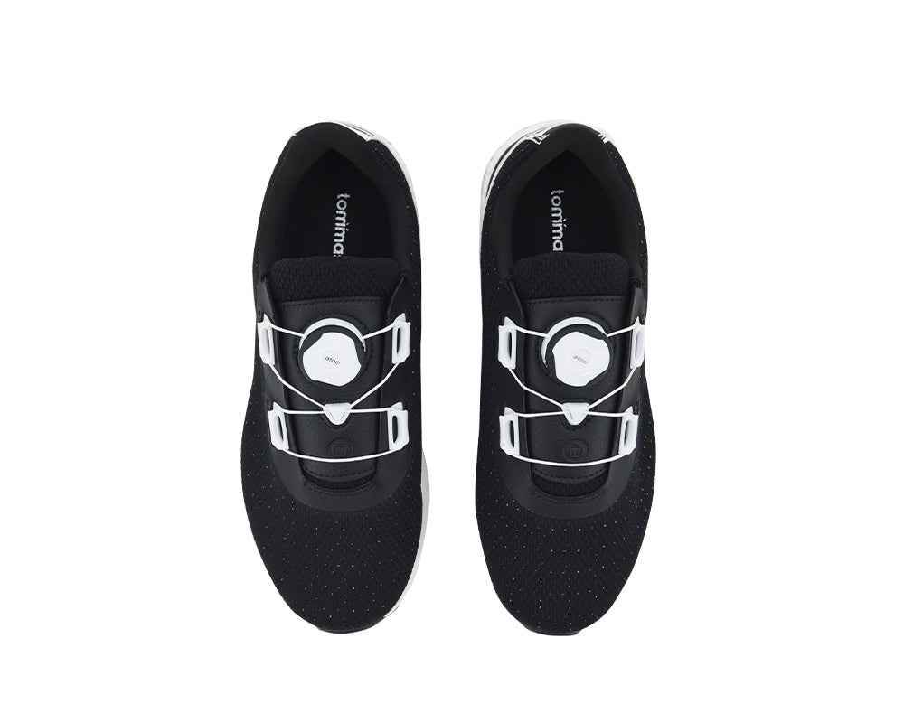 Black indoor cycling shoes with white quick laces on a white background