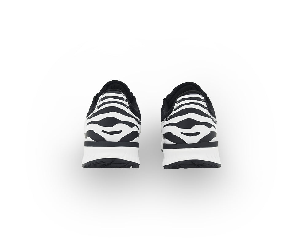 Black and white Zebra striped indoor cycling shoes on a white background