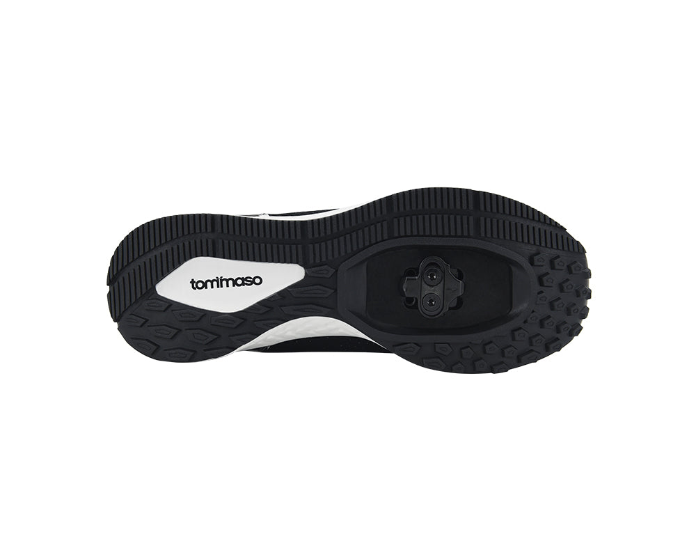 Black and white shoe sole with 'tommaso' branding on a white background