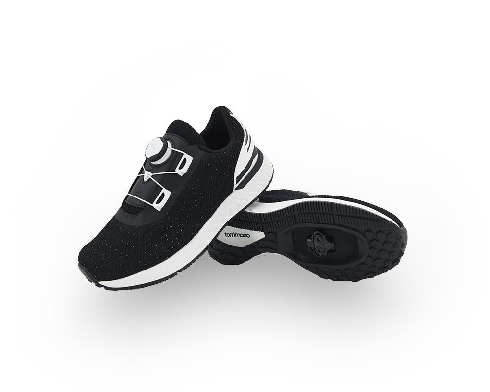 Black and white indoor cycling shoes on a white background