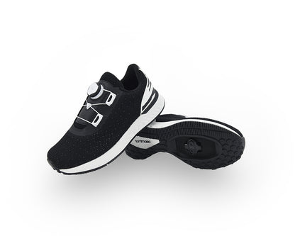 Black and white indoor cycling shoes on a white background
